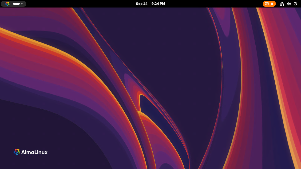 The AlmaLinux GNOME desktop in the remote session after signing in, with the AlmaLinux wallpaper, the top bar clock and the orange screen sharing indicator showing the session is remote