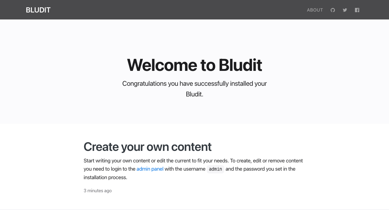 The Bludit starter site in the Alternative theme with the Welcome to Bludit header and the Create your own content example page