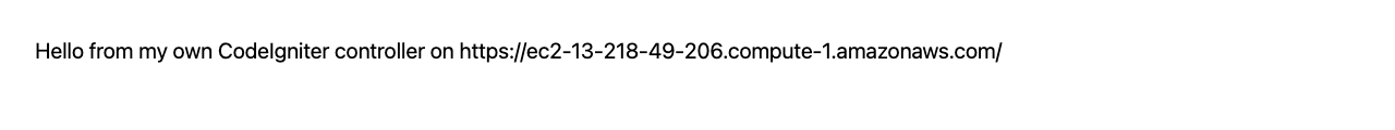 The new /hello route served over HTTPS in the browser, showing the controller's greeting and the configured site URL