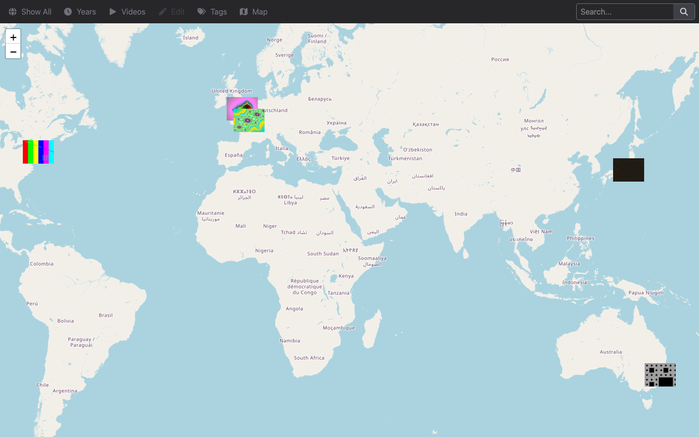 The HomeGallery Map page showing image thumbnails placed on a world map at London, Paris, New York, Tokyo and Sydney